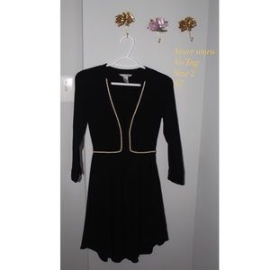 Never worn,black three quarter length sleeve dress